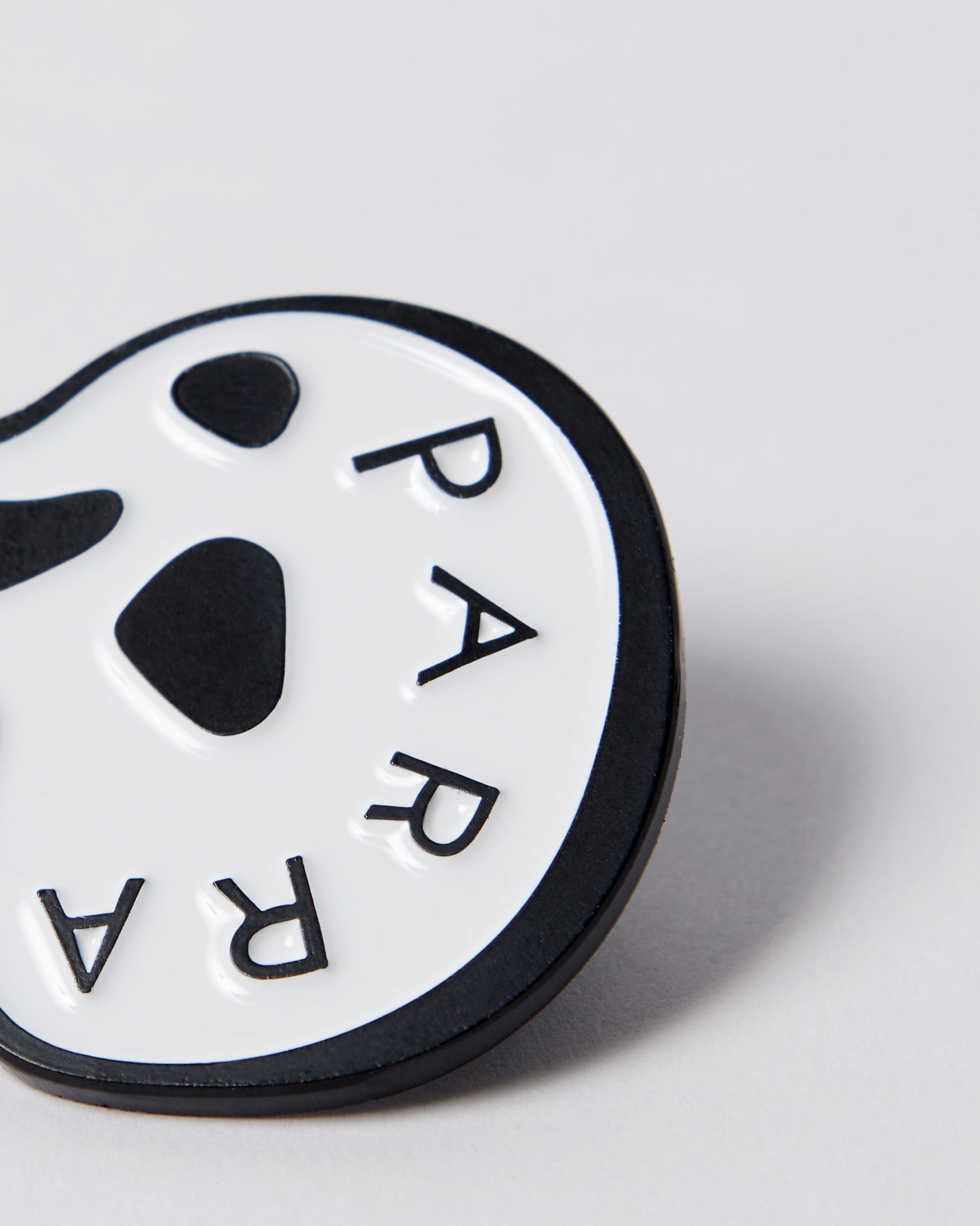Skulled enamel pin