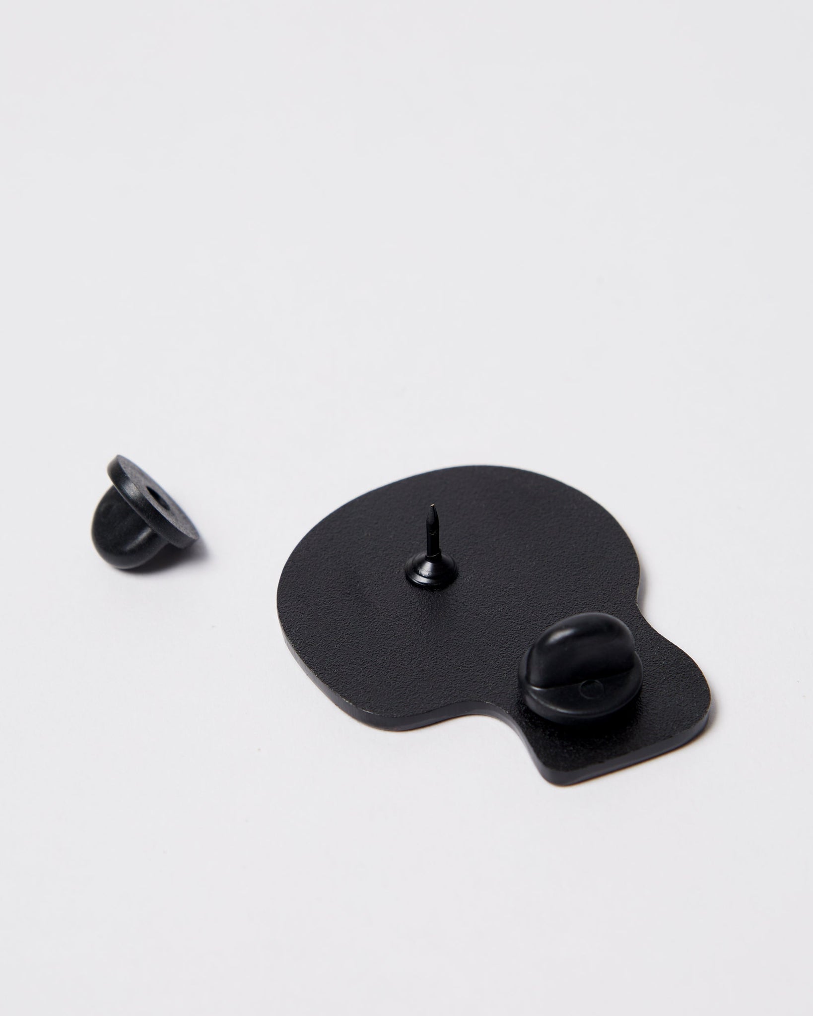 Skulled enamel pin