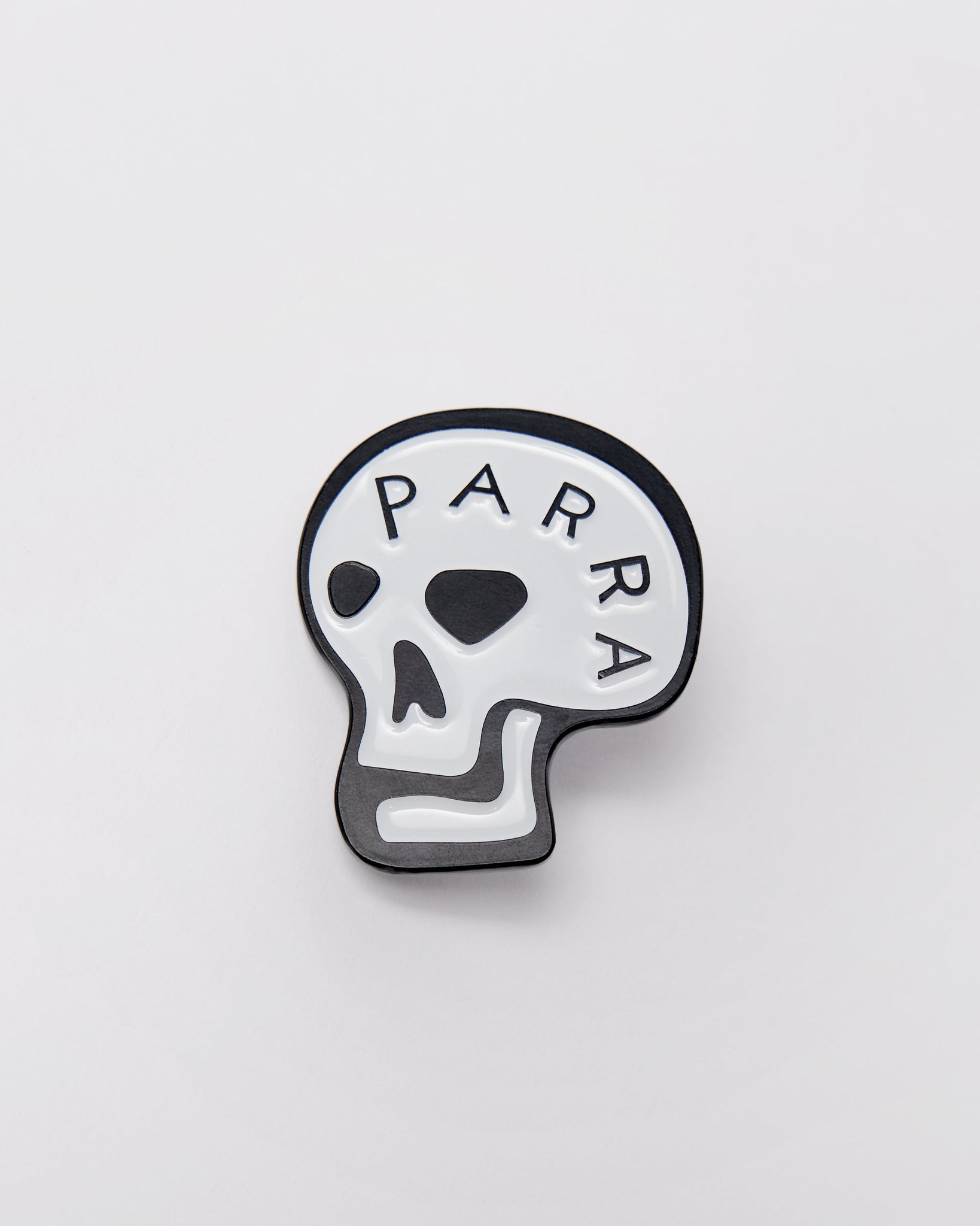 Skulled enamel pin
